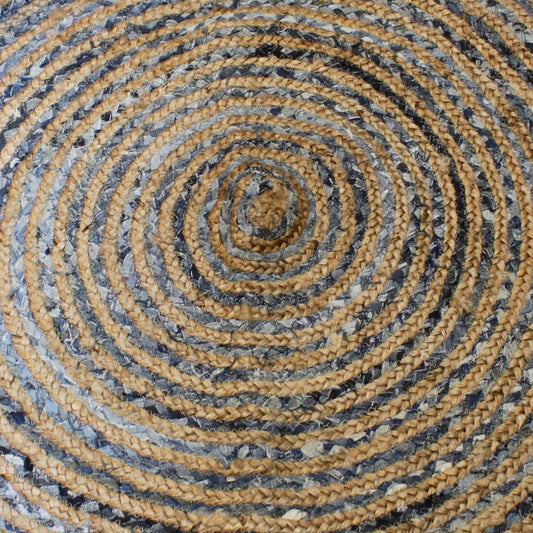 Close-up of a woven circular mat with concentric circles in brown and gray.