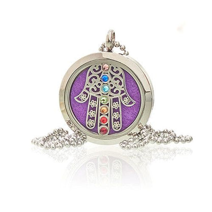 Decorative pendant with a purple background and colorful stones on a white background
