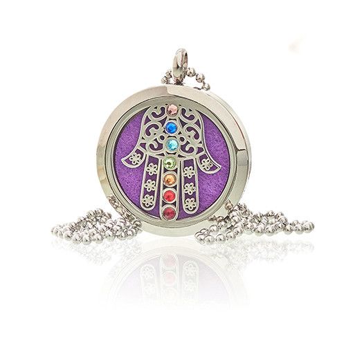 Decorative pendant with a purple background and colorful stones on a white background