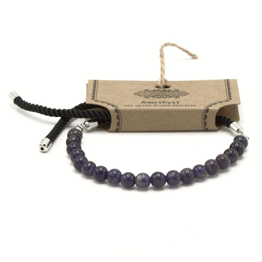Amethyst bracelet with silver clasp on a cardboard packaging labeled 'Amethyst' on a white background