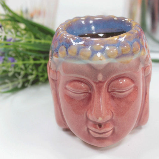 Ceramic face-shaped vase with a blurred background