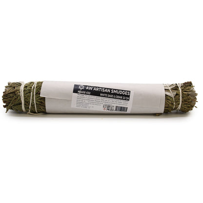 Artisan smudge stick wrapped in paper with a label on a white background