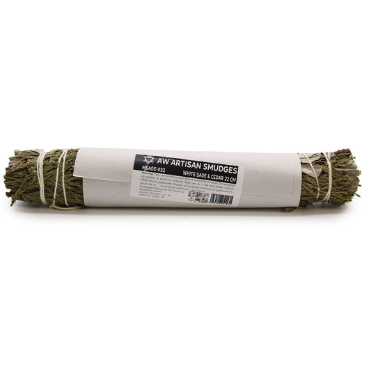 Artisan smudge stick wrapped in paper with a label on a white background
