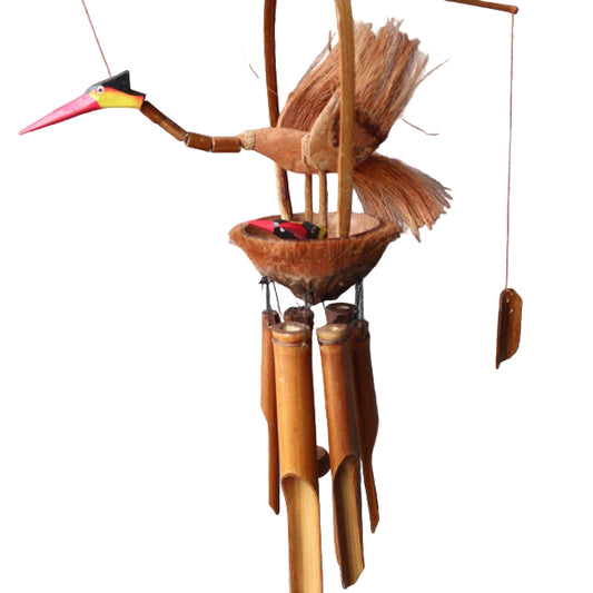 Wooden wind chime shaped like a toucan against a gray wall