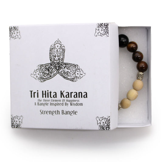 Tri Hita Karana strength bangle in a white box on a white background