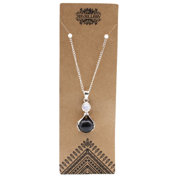 Necklace with a black teardrop pendant on a brown jewelry card