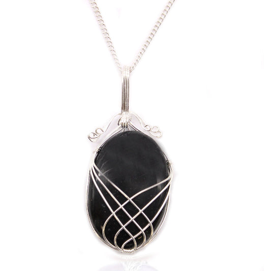 Black stone pendant with silver wire wrapping on a white background