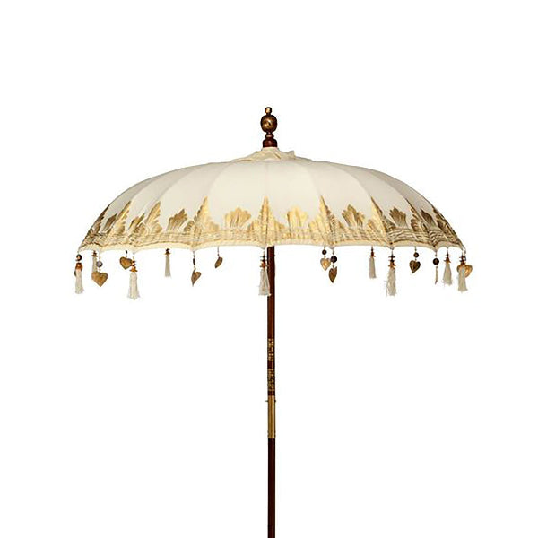 Decorative umbrella with tassels and heart shapes on a white background