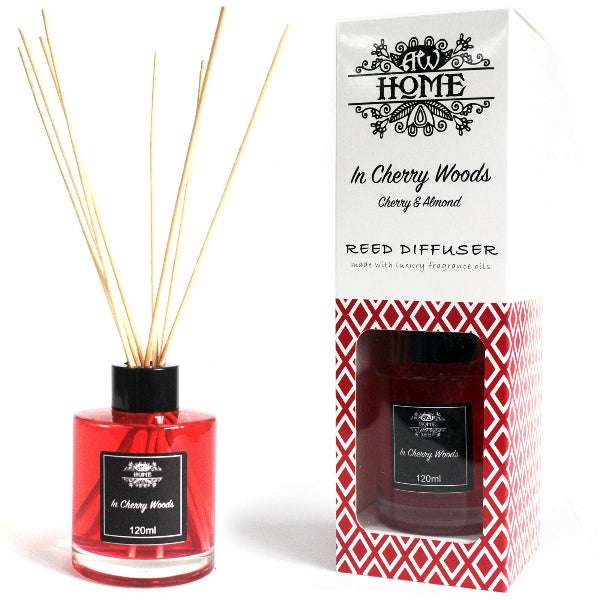 Red reed diffuser with packaging labeled 'At Home' in Cherry Woods on a white background
