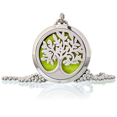 Silver locket with tree design on a white background