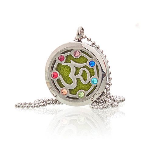 Necklace with a round pendant featuring a green symbol and colorful stones on a white background