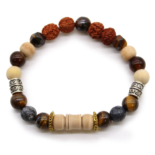Multicolored beaded bracelet with metal accents on a white background