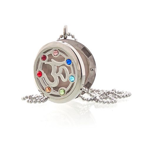 Silver locket with colorful stones on a white background