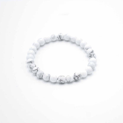 White beaded bracelet on a white background