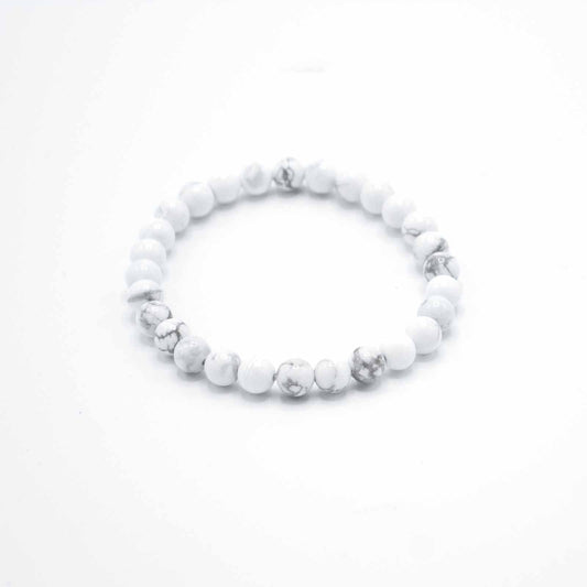 White beaded bracelet on a white background