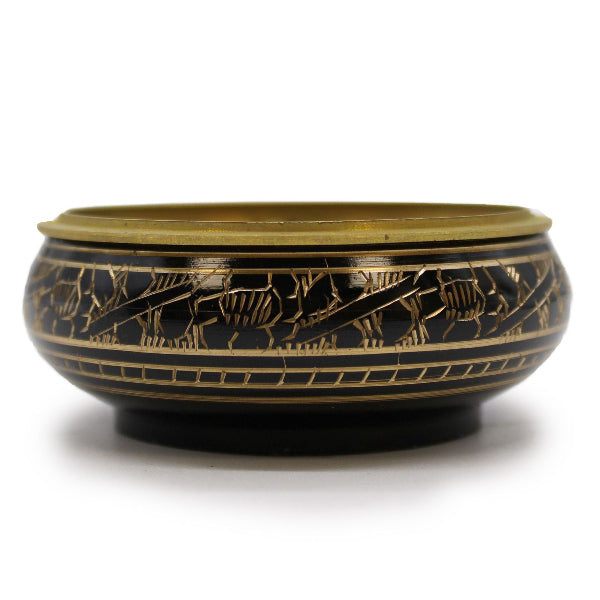 Decorative bowl with gold and black patterns on a white background