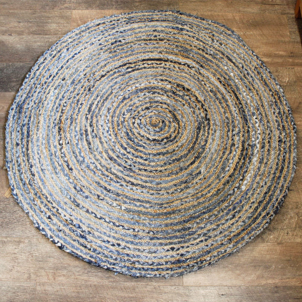 Round braided rug on a wooden floor