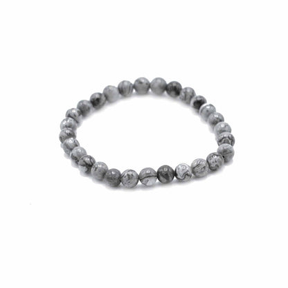 Gray beaded bracelet on a white background