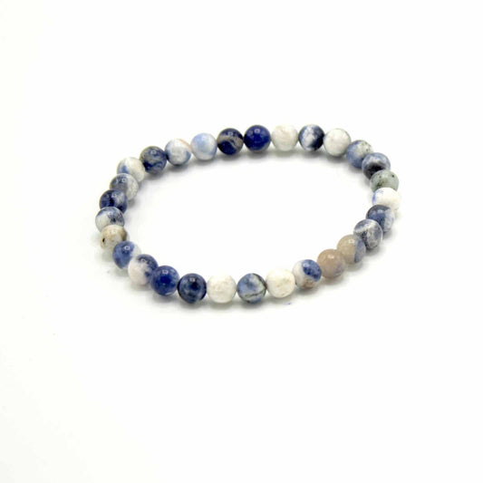 Beaded bracelet with blue and white beads on a white background