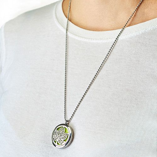 Necklace with a pendant worn by a person on a white background