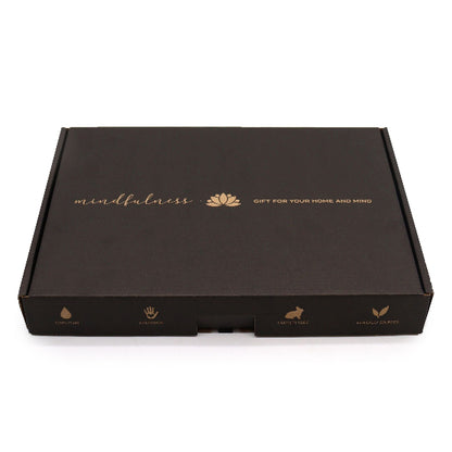 Black box with gold text and branding on a white background
