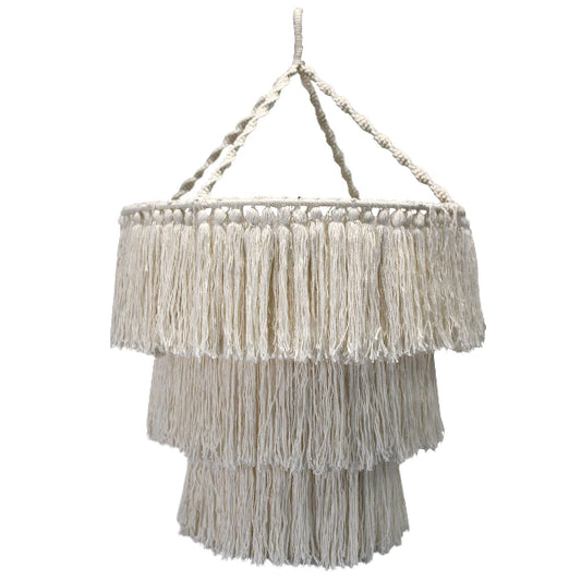 Macrame wall hanging with fringes on a white background