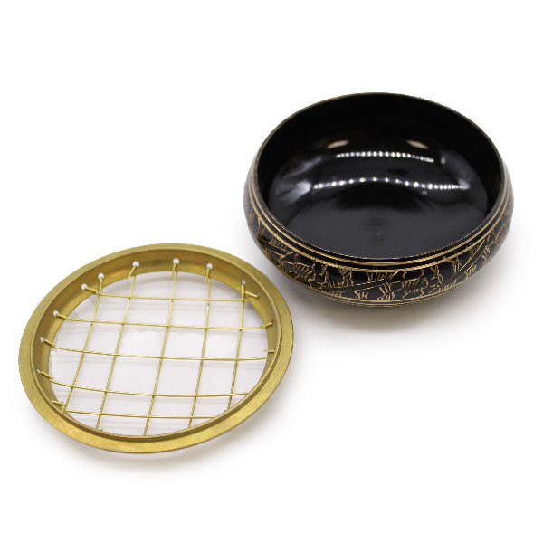Black and gold decorative items on a white background