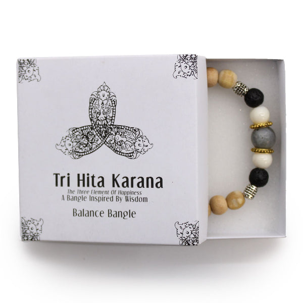 Tri Hita Karana balance bangle in a box on a white background