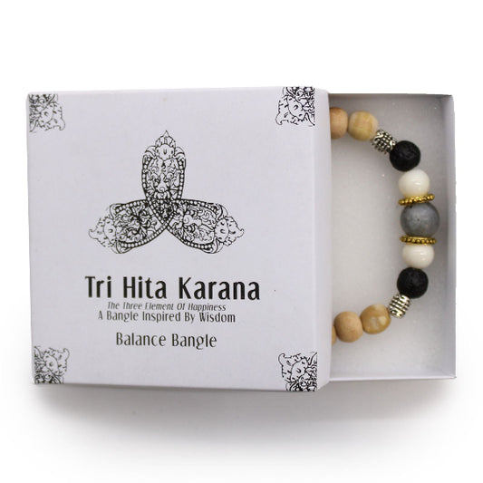 Tri Hita Karana balance bangle in a box on a white background
