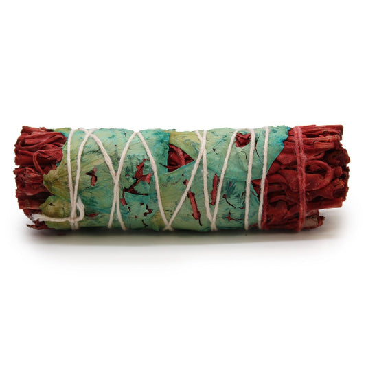 Rolled sage bundle with red and green colors on a white background