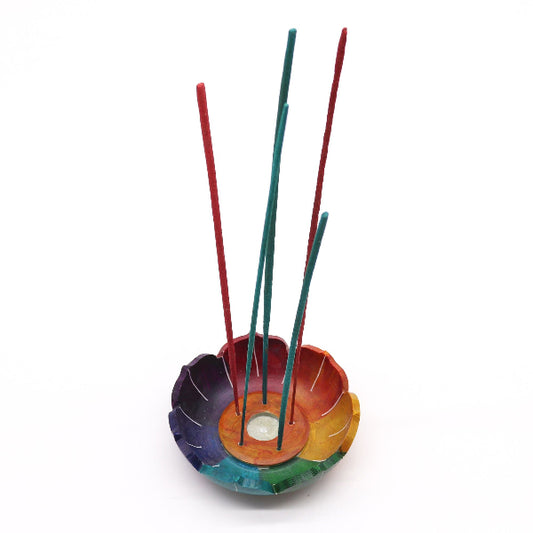 Colorful incense holder with three sticks on a white background