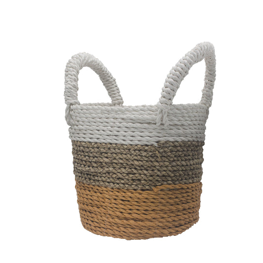 Woven basket with two-tone design on a white background